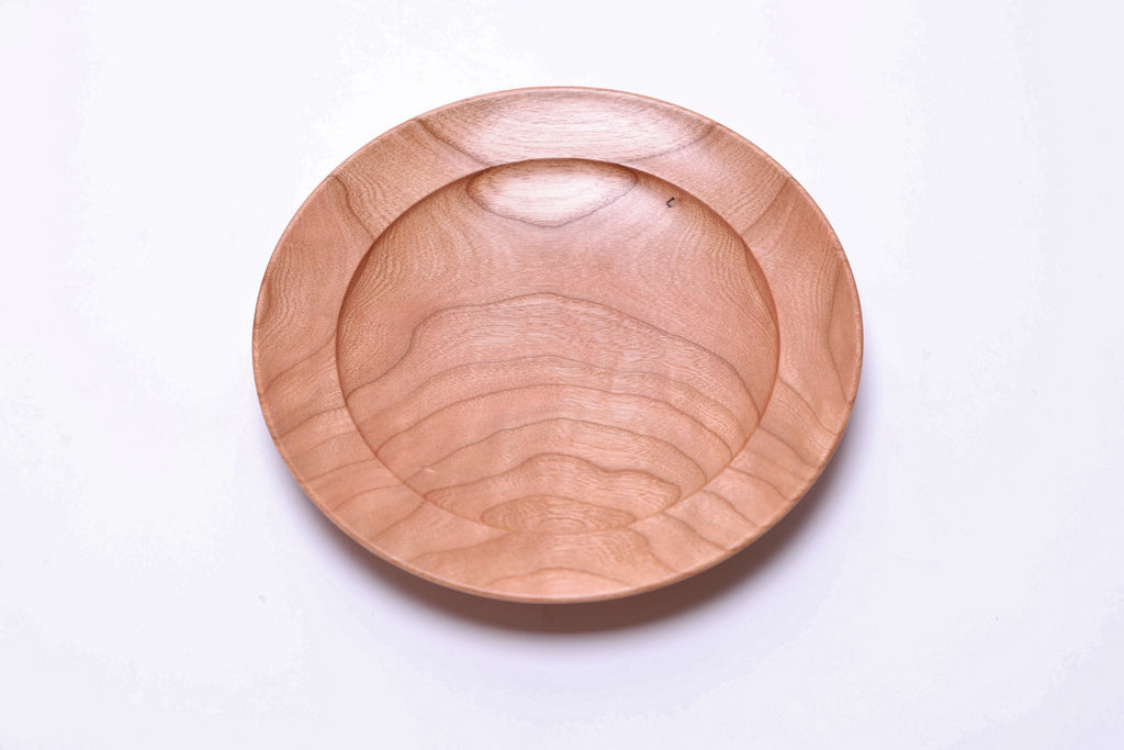 Curly wild black cherry ring dish 6 1/8 inches showing amber curly growth ring transition lines and pink copper coloration