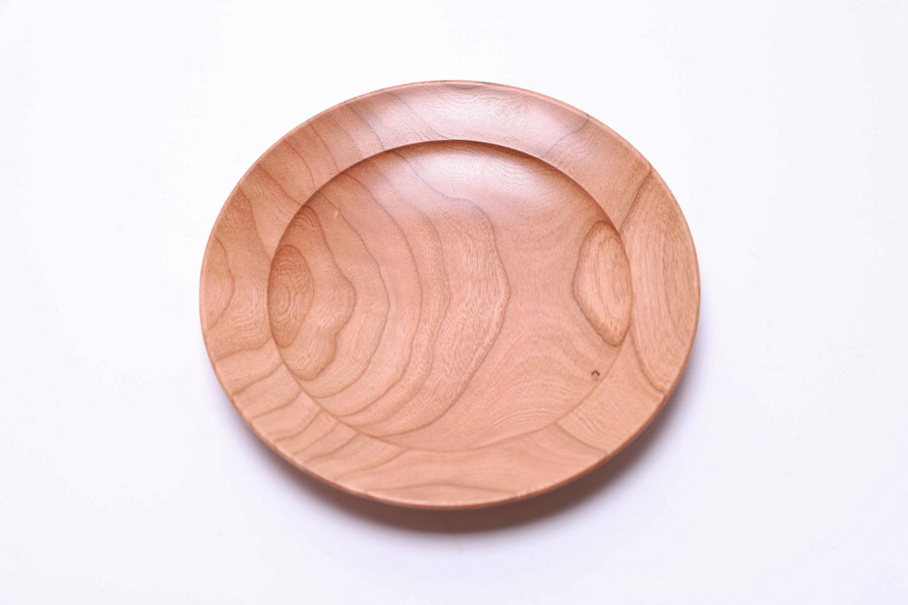 Handcrafted wild black cherry wooden ring dish side view displaying 7/8 inch depth and sharp rim transition