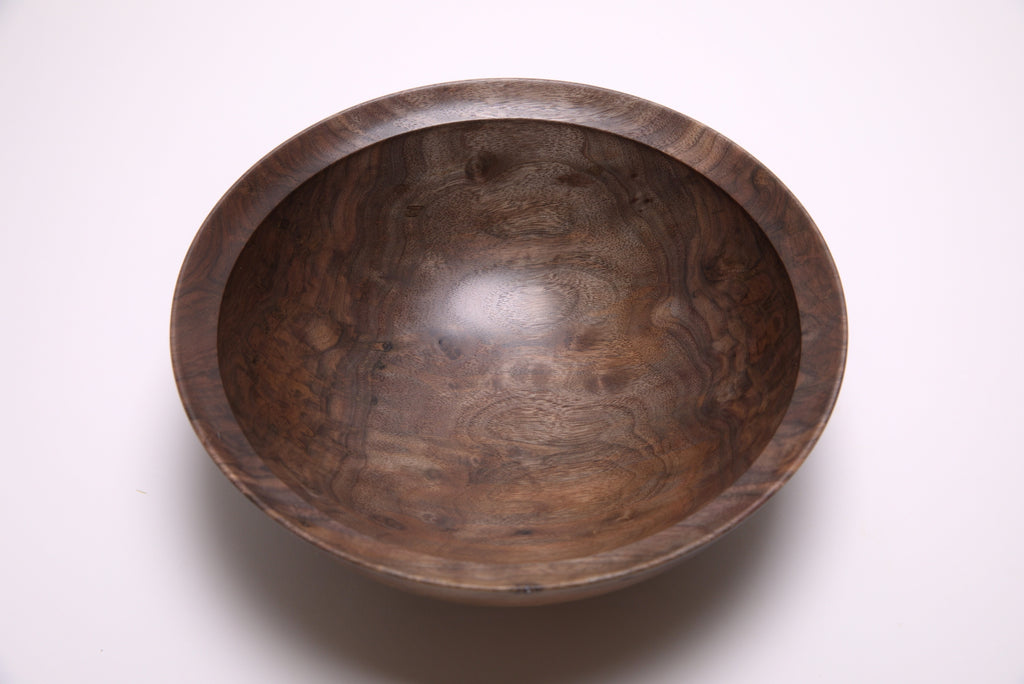 Curly wild black walnut wooden bowl 10 1/2 inches showing chatoyant bud scars and figured heartwood grain"