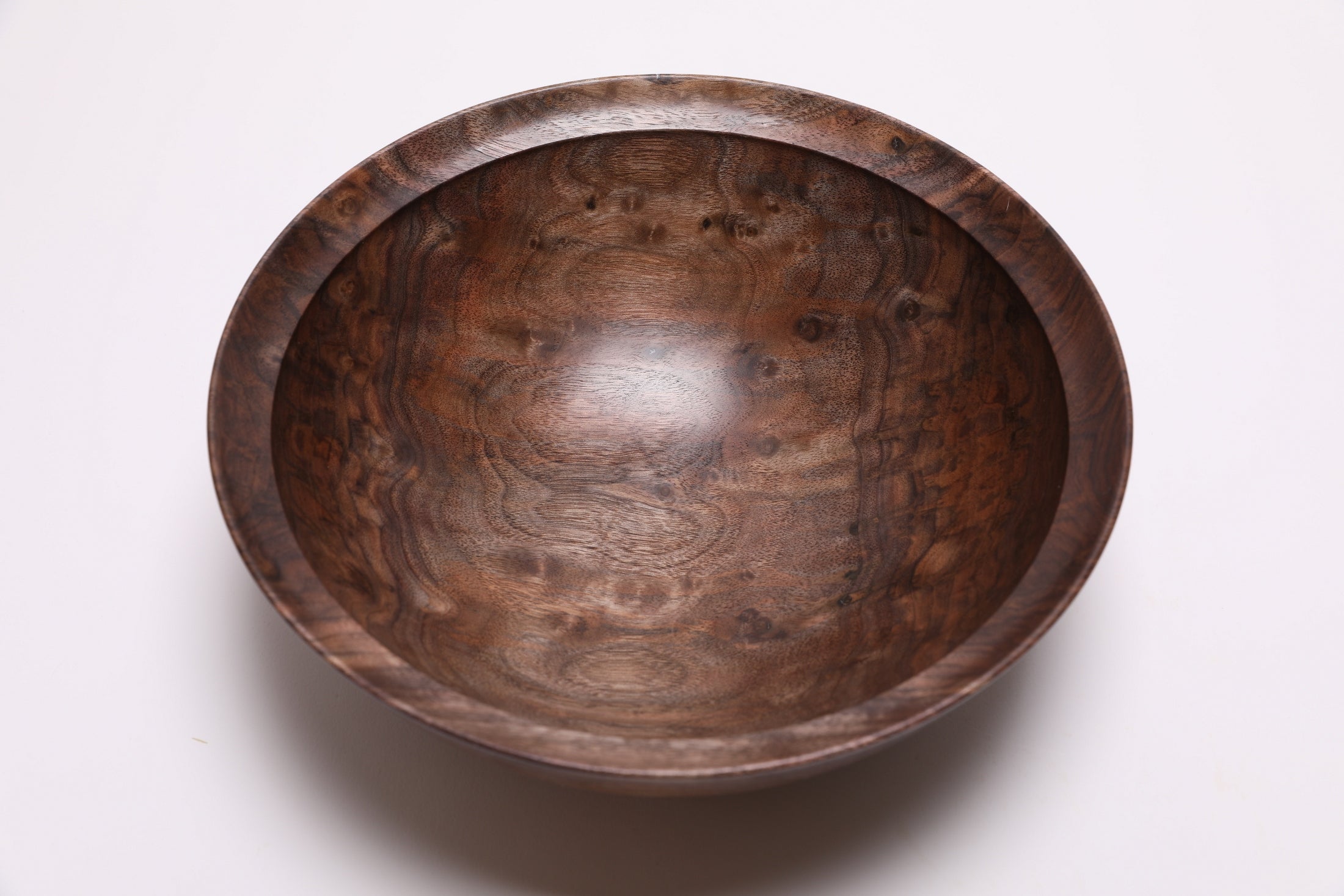 Wild black walnut bowl interior showing curly heartwood patterns and milk chocolate to dark chocolate tones