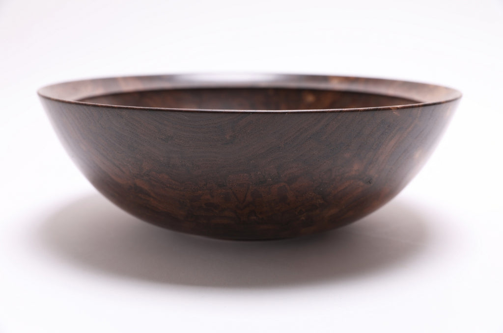 Wild black walnut wooden bowl side profile showing food-safe natural oil finish and smooth surface