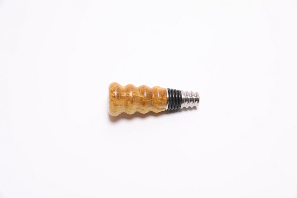 Handcrafted mulberry burl bottle stopper side view displaying natural wood grain and unique character