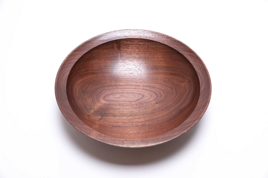 Wild black walnut wooden bowl 9 3/4 inches showing red undertones and chocolate grain patterns