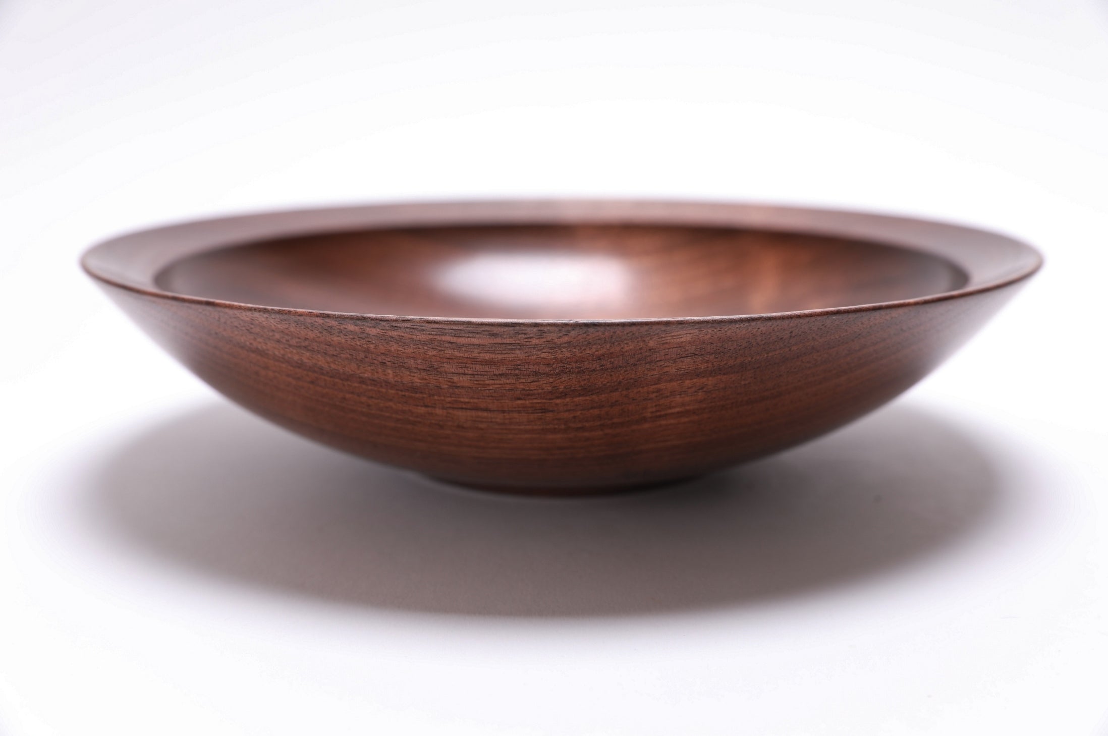 Wild black walnut bowl upside down showing rim and craftsmanship detail