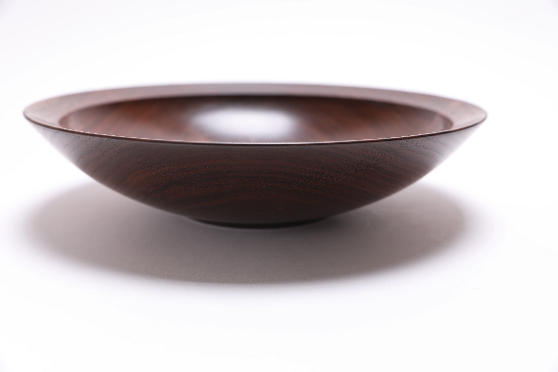 Black walnut wood bowl side profile showing food-safe natural oil finish and smooth surface