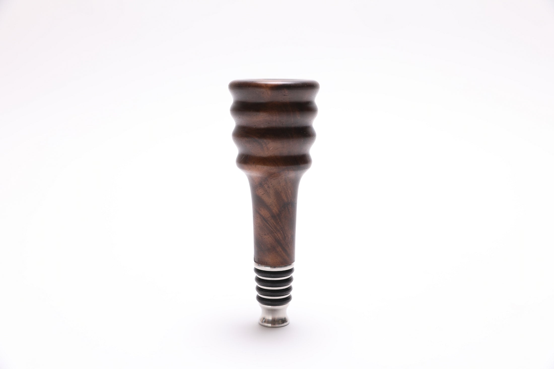 Claro walnut burl wine stopper detail view highlighting premium craftsmanship