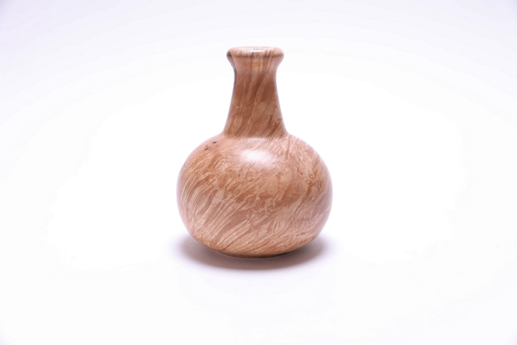 Handcrafted big leaf maple burl dry vase showing natural wood grain and figure