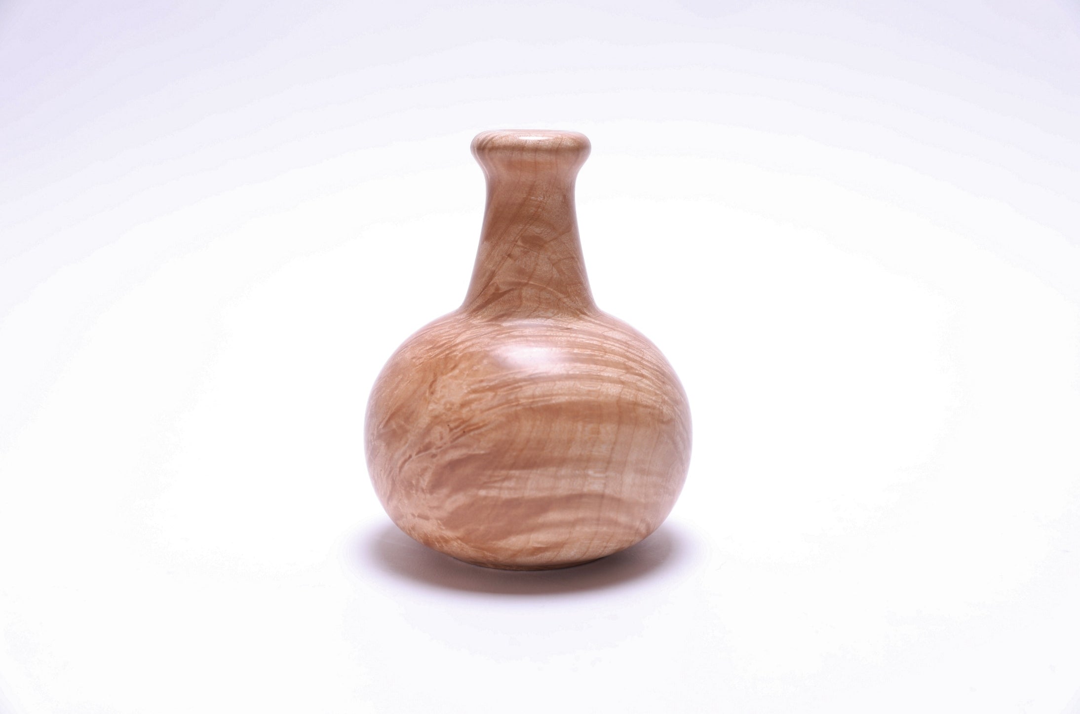 Side view of big leaf maple burl weed pot highlighting unique bark inclusions