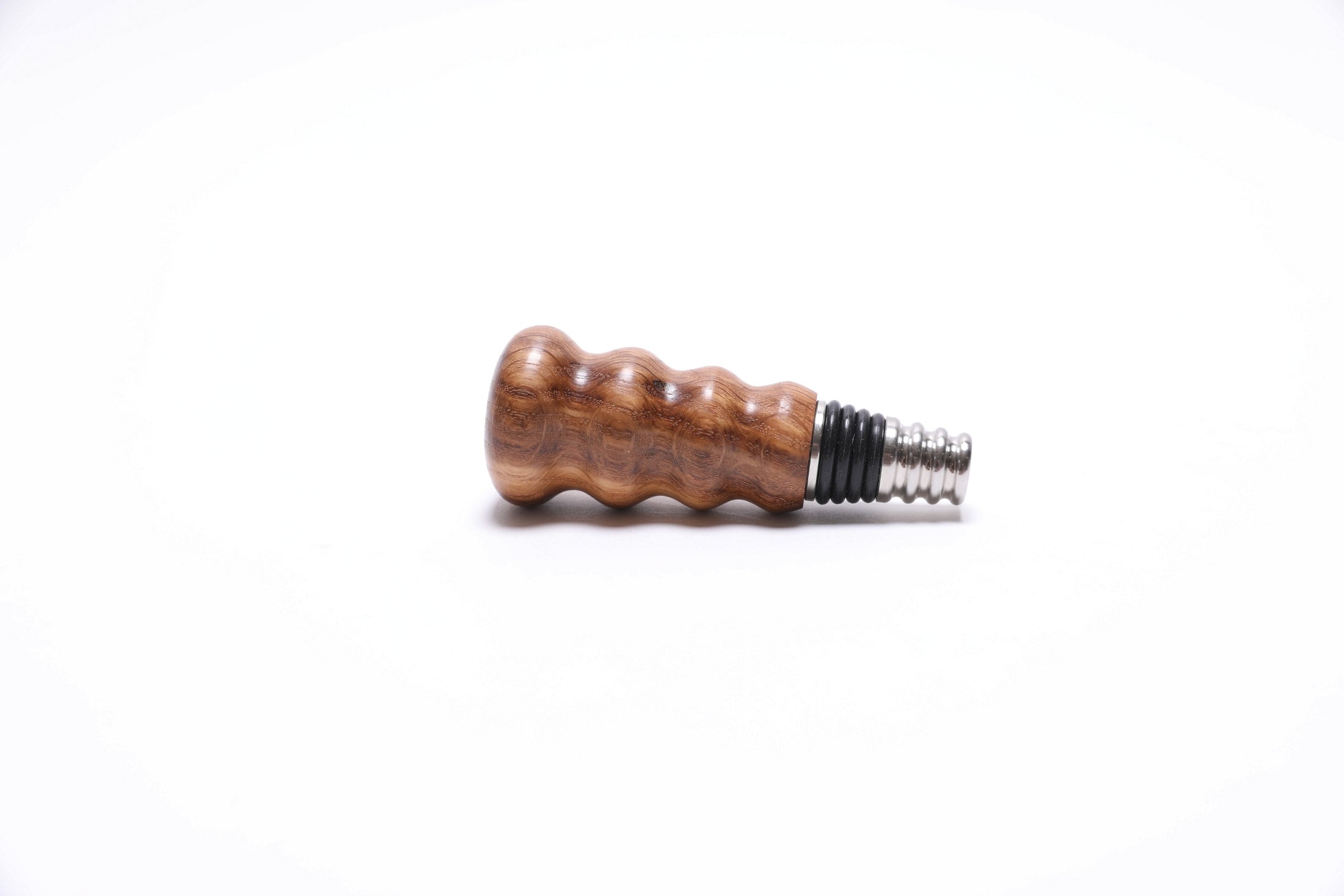 Detail view of handmade white oak wine stopper with food-safe finish