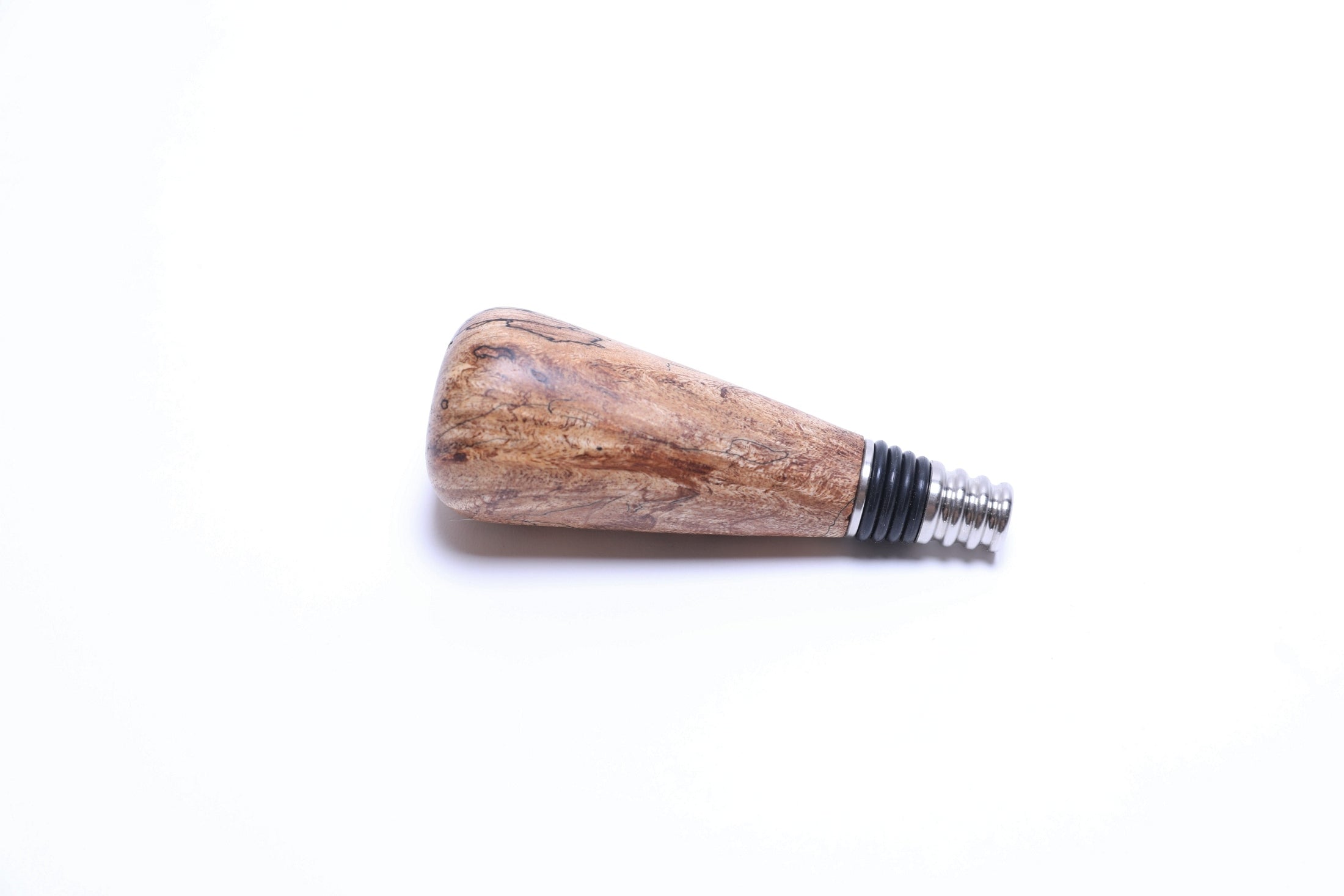 Detail view of spalted maple wine stopper highlighting black transition lines
