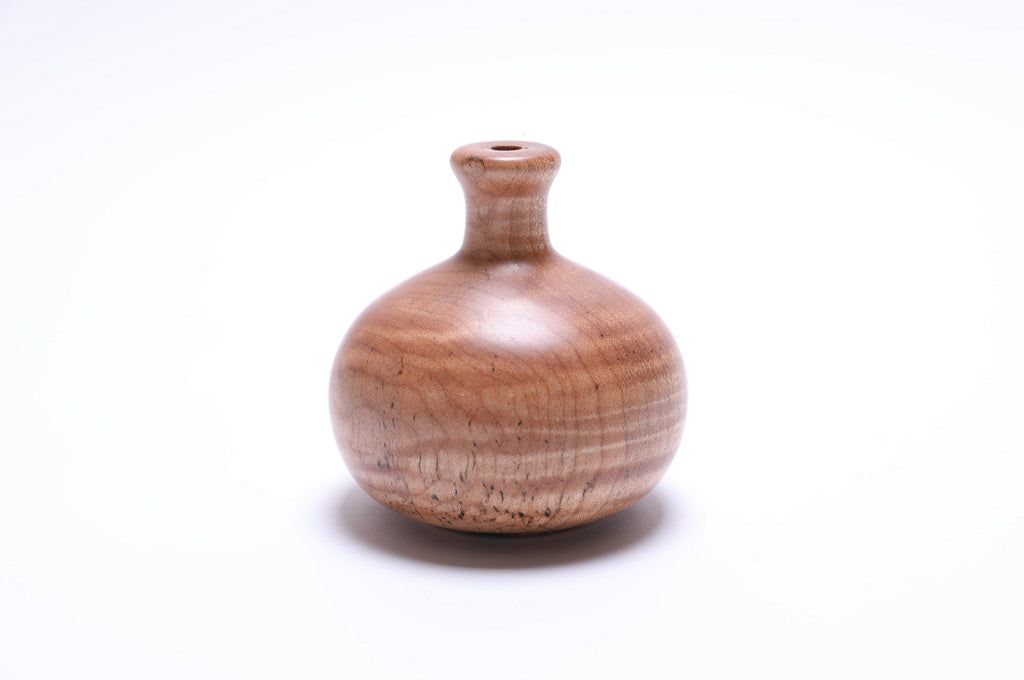 Side view of tiger maple weed pot showing opening and distinctive tiger stripe patterns