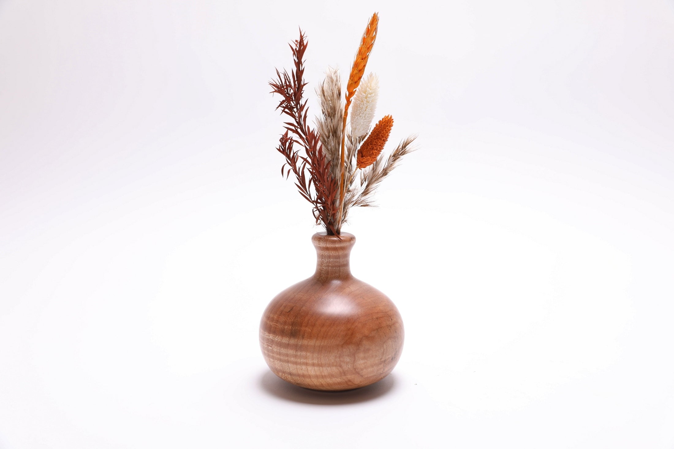 Tiger big leaf maple weed pot with dramatic striped grain patterns, handcrafted by Sanders Woodworking