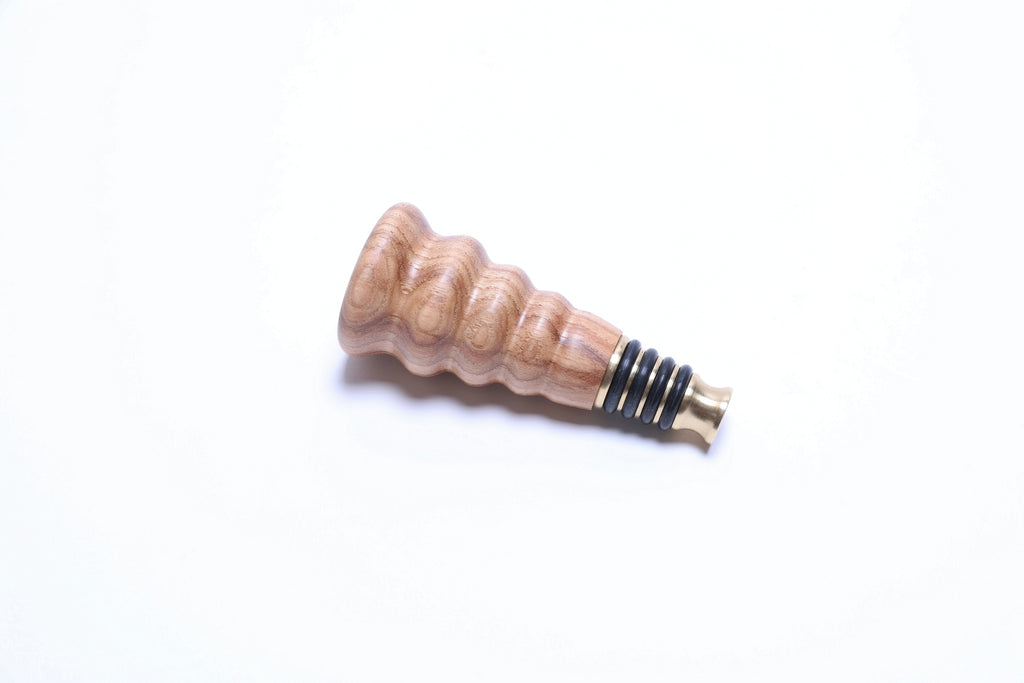 Side view of hickory wine stopper showing natural wood grain detail