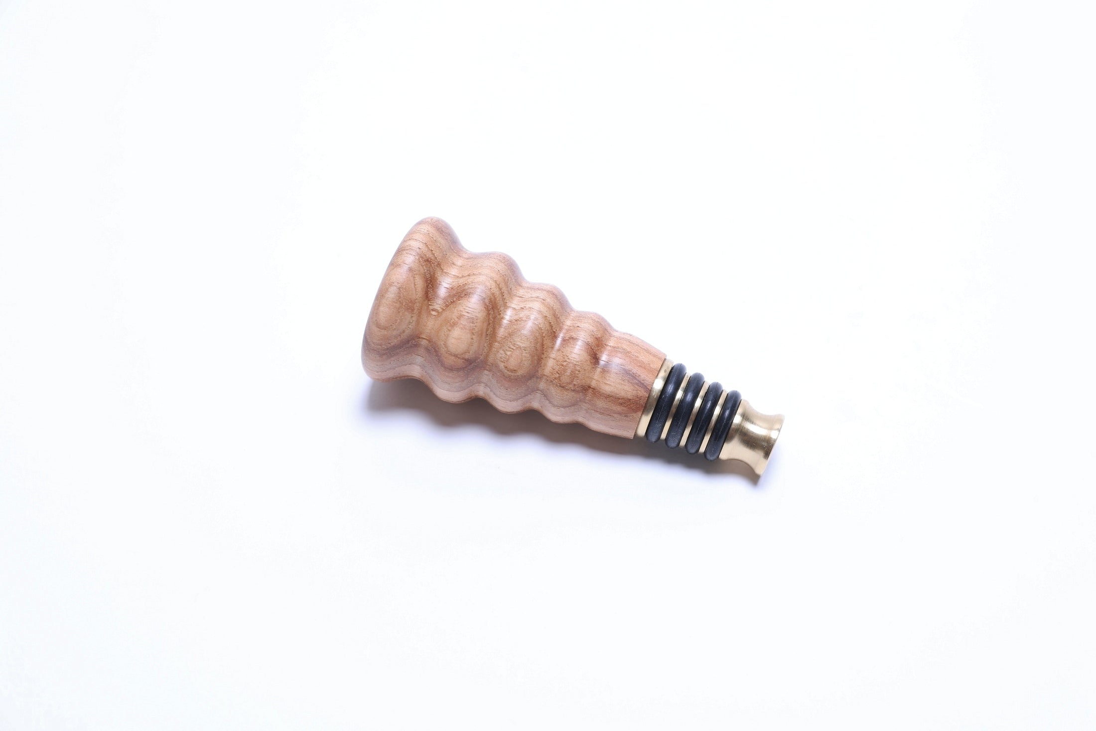 Side view of hickory wine stopper showing natural wood grain detail