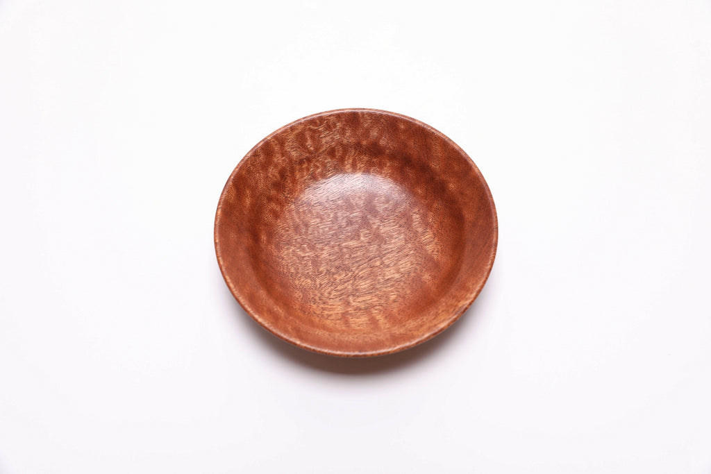 Top view of handcrafted pommele sapele ring dish showing dappled wood figure