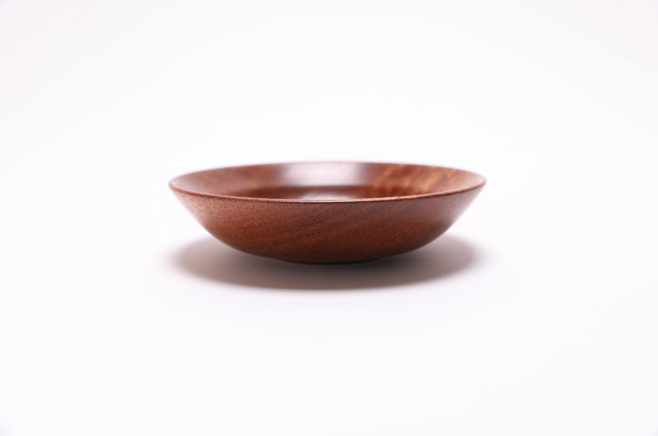 Side profile of sapele wooden ring dish with rounded taper design