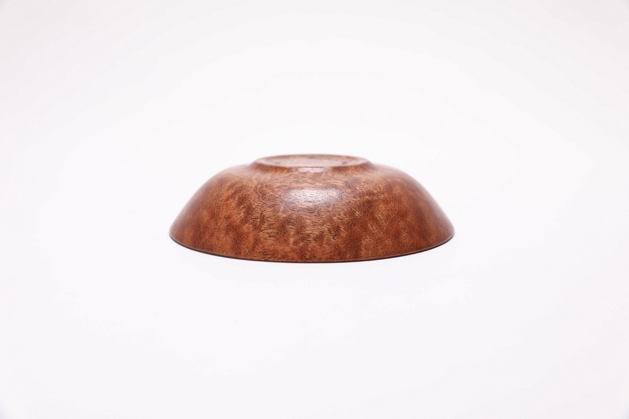 Upside down view of handmade wooden ring dish with food-safe natural oil finish