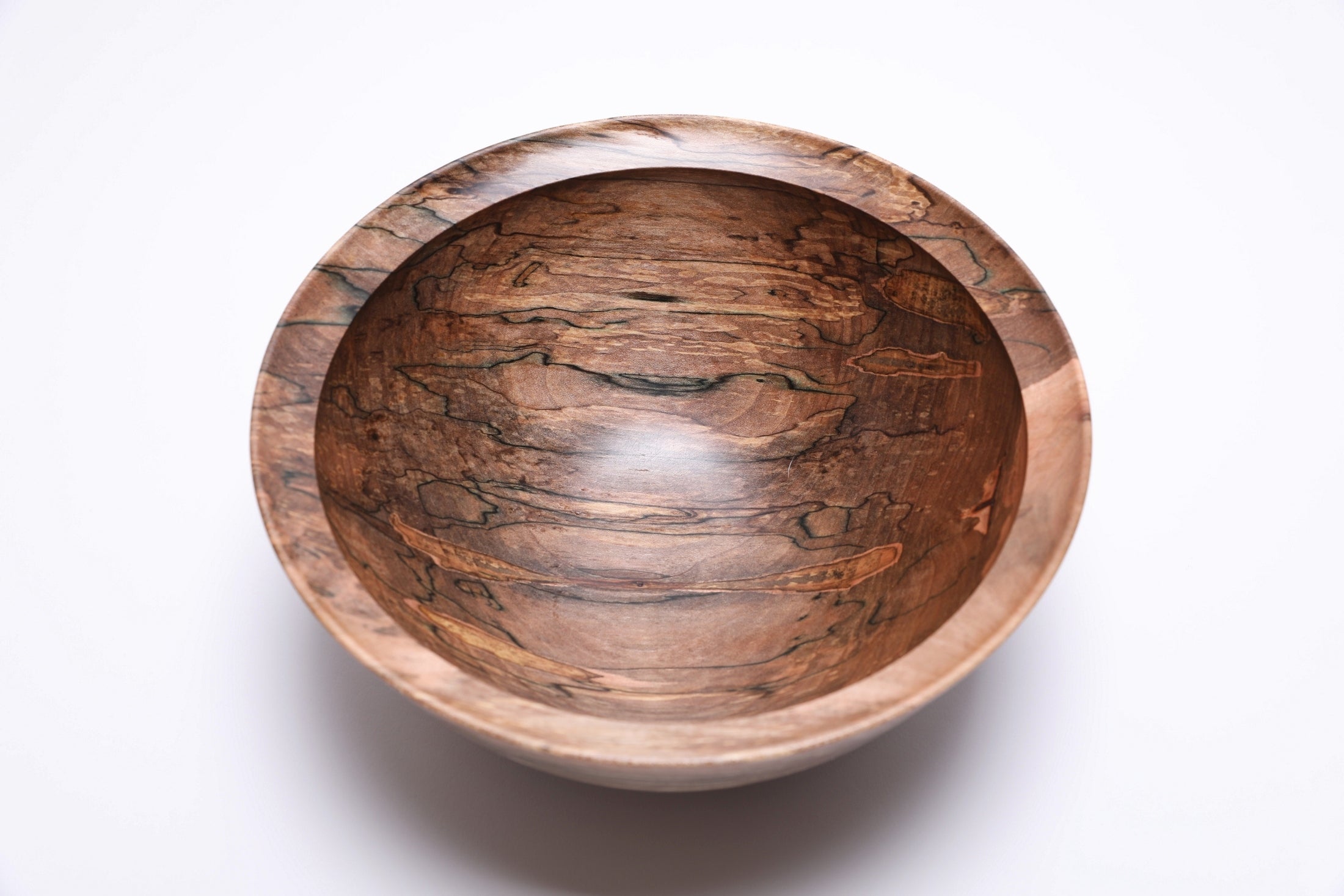 Interior of spalted maple bowl with food-safe oil finish and smooth surface