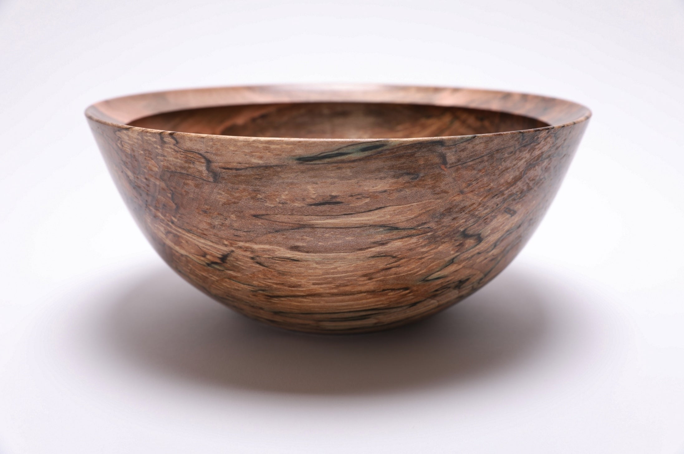 Side profile of spalted maple wooden bowl, 10 inches by 4.25 inches, handmade in North Carolina