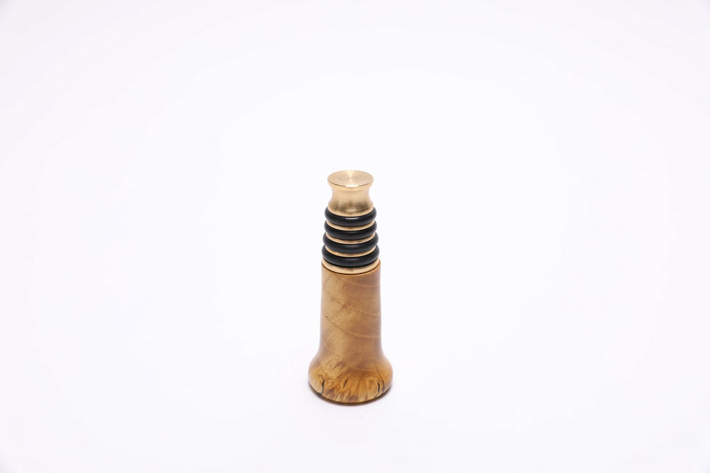 Inverted view of handmade wooden wine stopper with brass hardware and premium burl wood