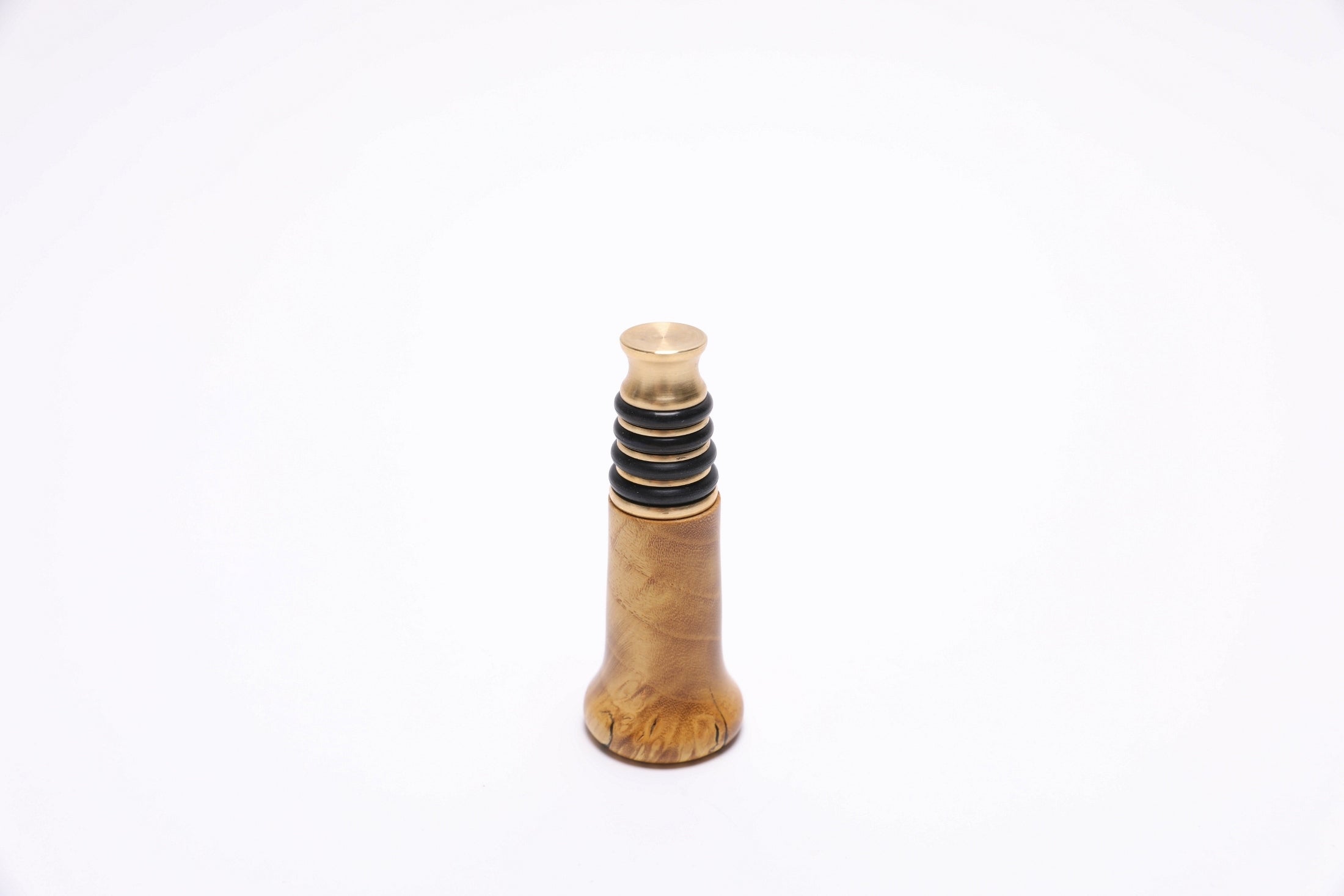 Inverted view of handmade wooden wine stopper with brass hardware and premium burl wood