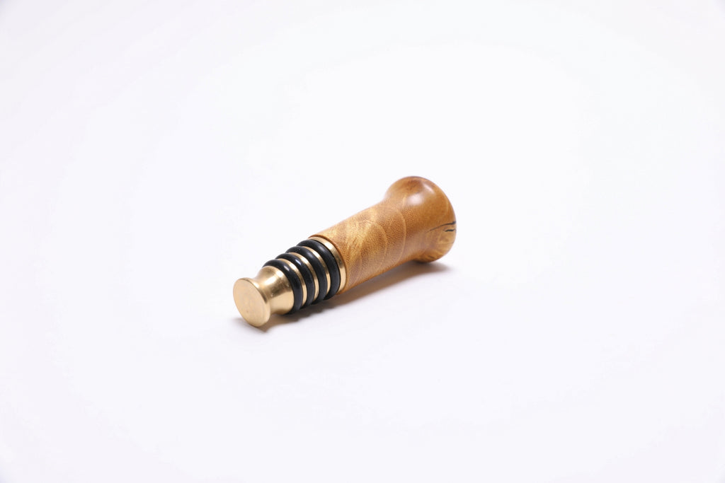 Mulberry burl bottle stopper made in USA showing one-of-a-kind wood character