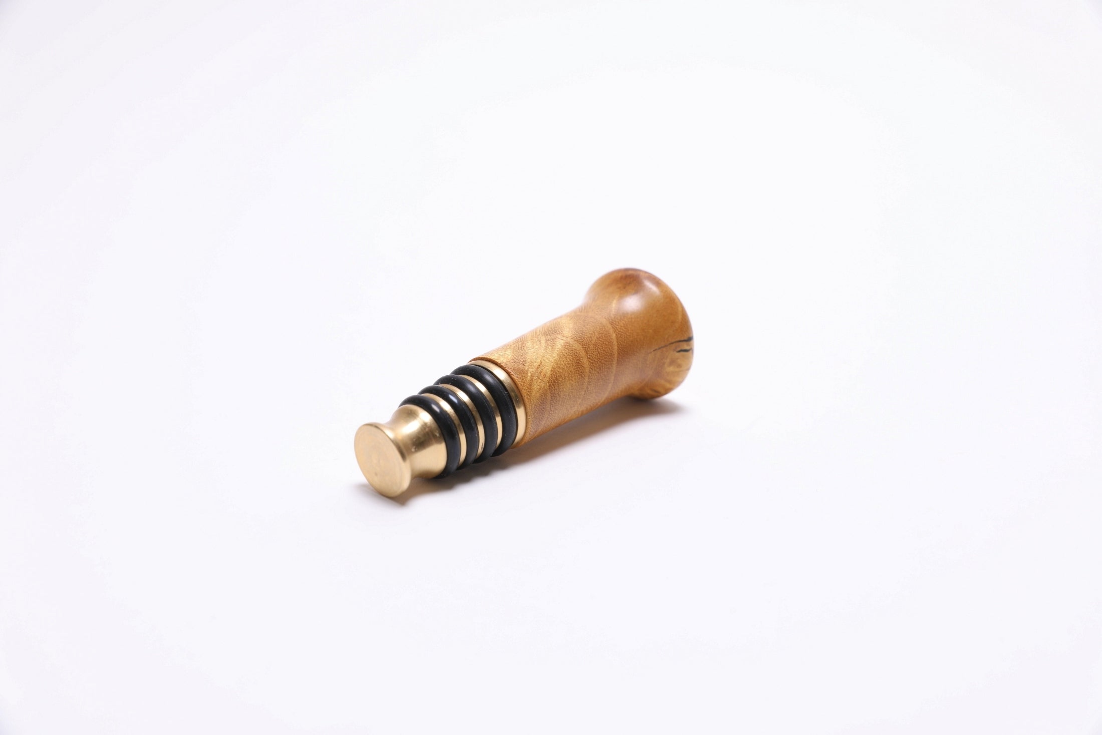 Mulberry burl bottle stopper made in USA showing one-of-a-kind wood character
