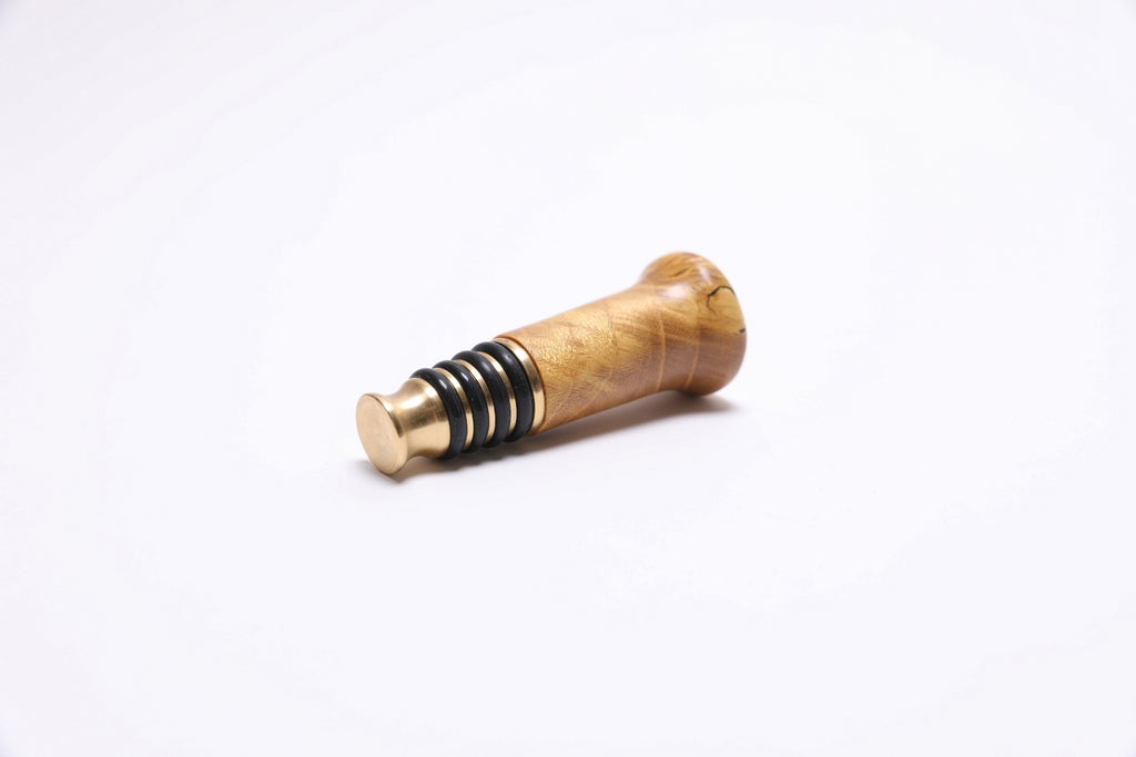 Artisan-crafted mulberry burl wine stopper with warm natural tones and oil finish