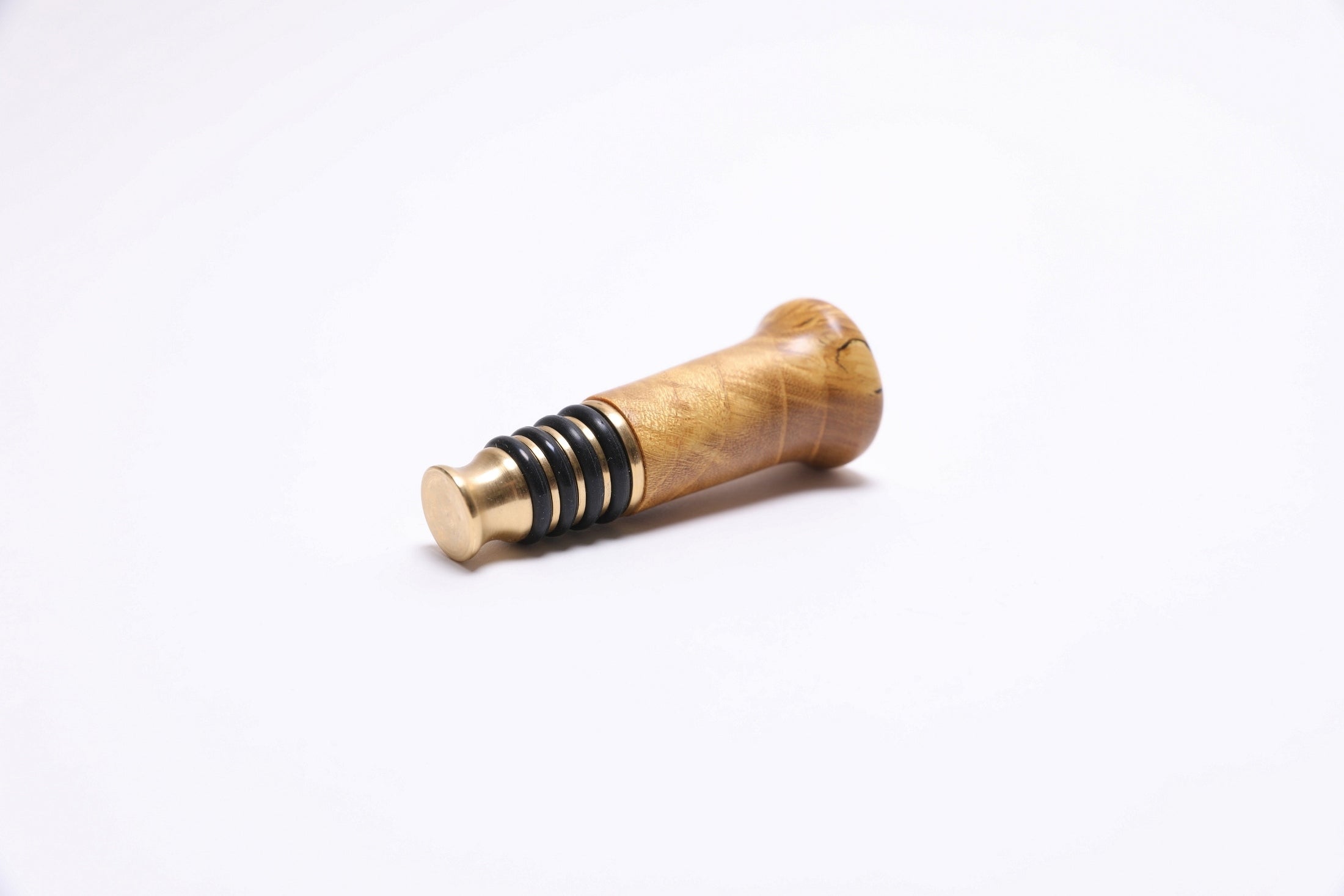 Artisan-crafted mulberry burl wine stopper with warm natural tones and oil finish