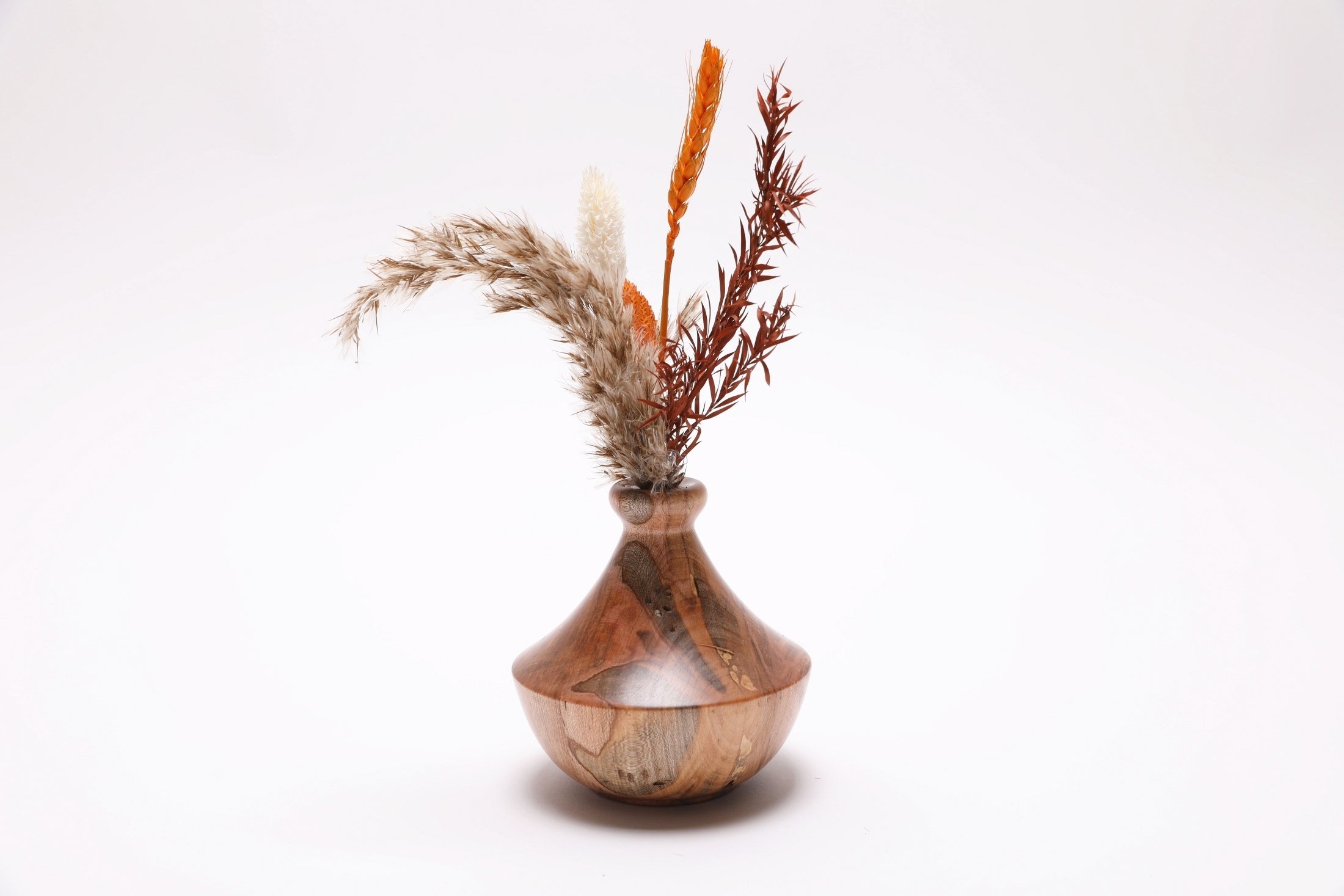 Handmade spalted ambrosia maple weed pot with dried flowers and Far East-inspired form and natural oil finish