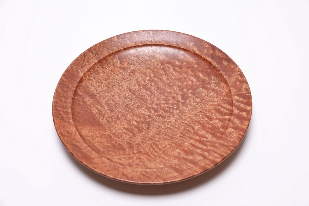 Handmade African sapele wooden bowl with raised foot and artisan craftsmanship