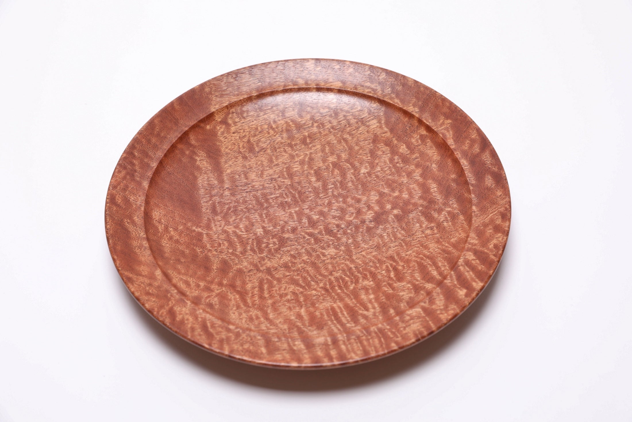 Handmade pommele sapele shallow bowl with stunning chatoyant dappled figure