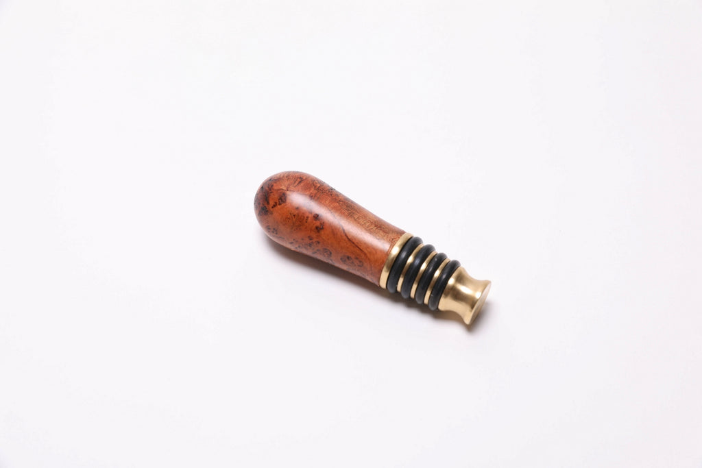 Handmade wild black cherry burl wine stopper with copper tones and natural oil finish