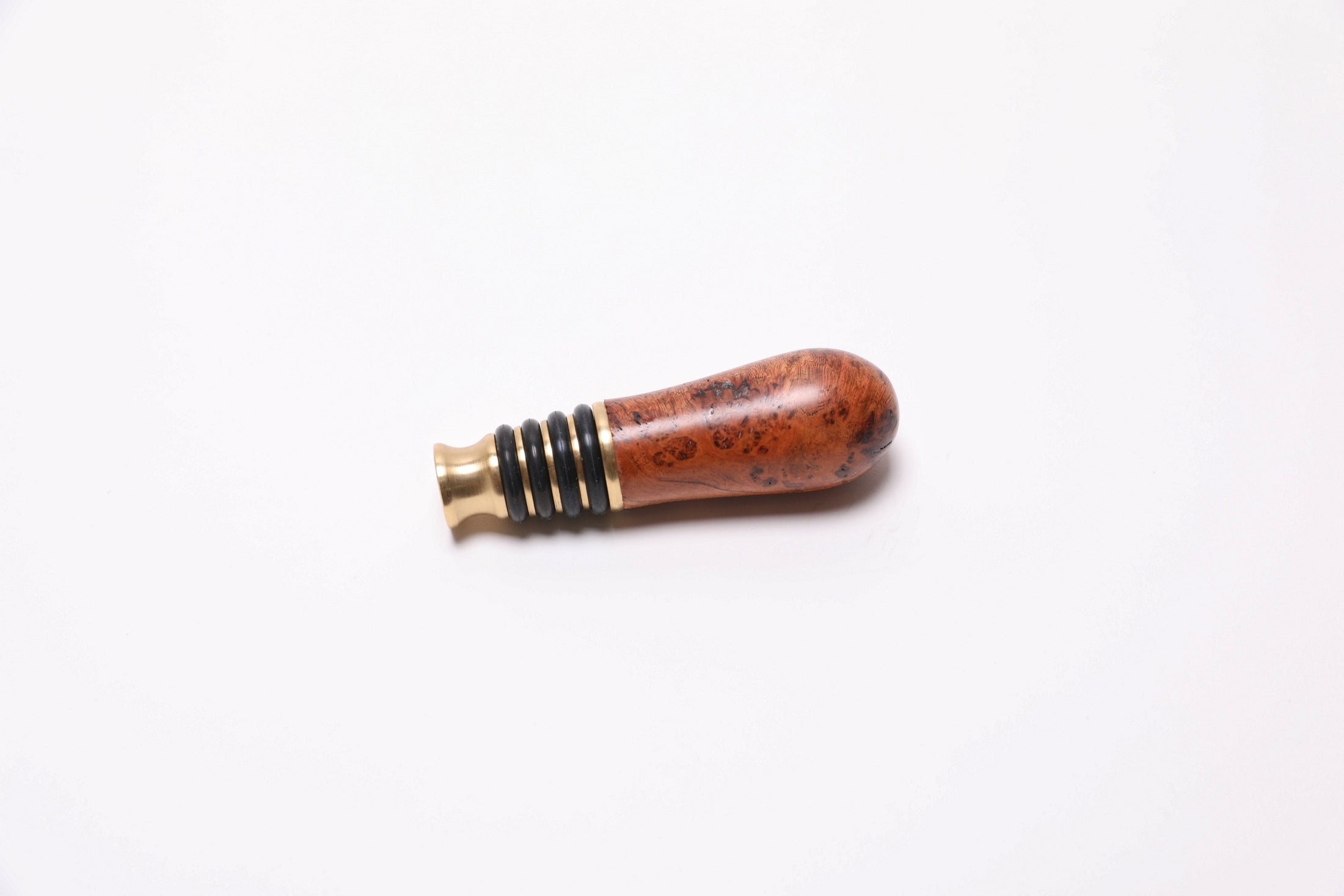 Handcrafted cherry burl wine stopper with warm copper coloration and food-safe finish
