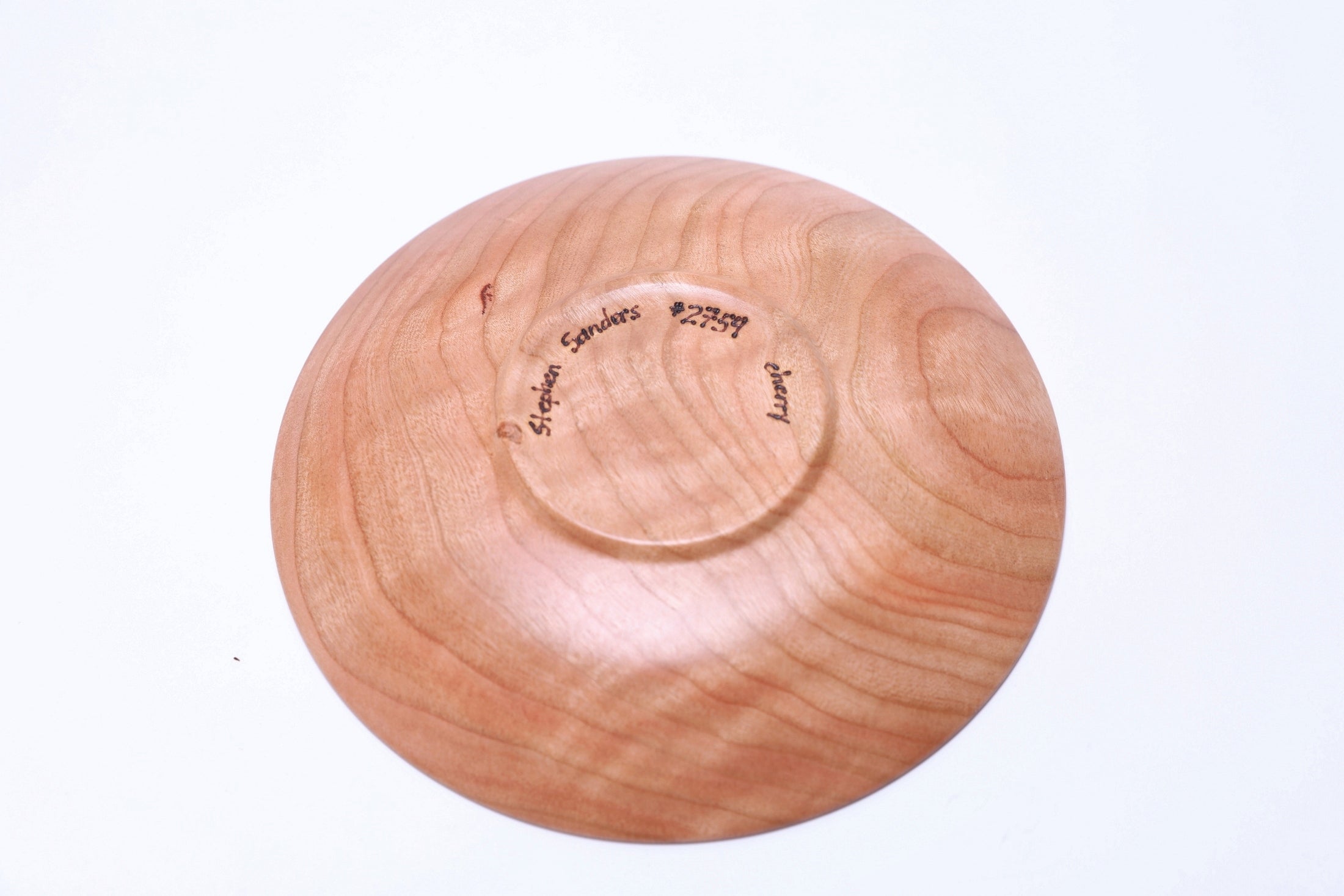 Upside down view of artisan-crafted wild black cherry ring dish made in USA with unique wood character