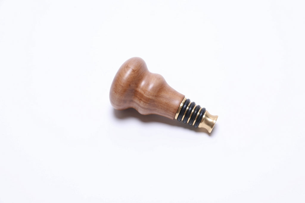 Close-up of rescued pear wood grain showing fine texture and warm honey coloration