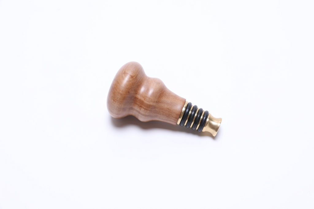 Side profile of pear wood wine stopper, 3⅝ inches tall, handmade in North Carolina