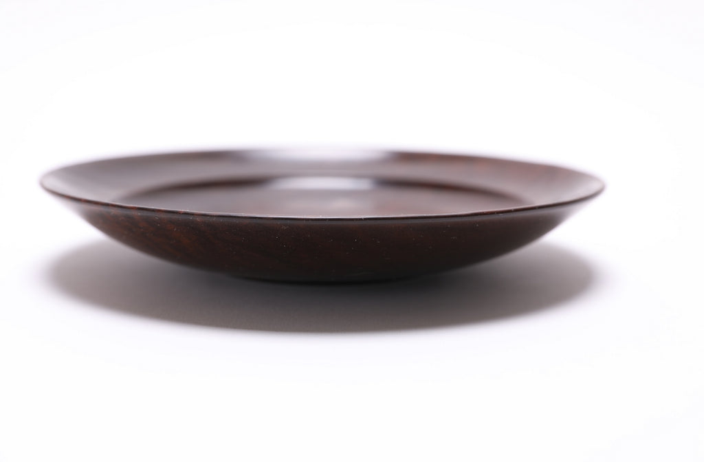 side view of roasted maple wooden bowl, bottom view showing turned foot and finish