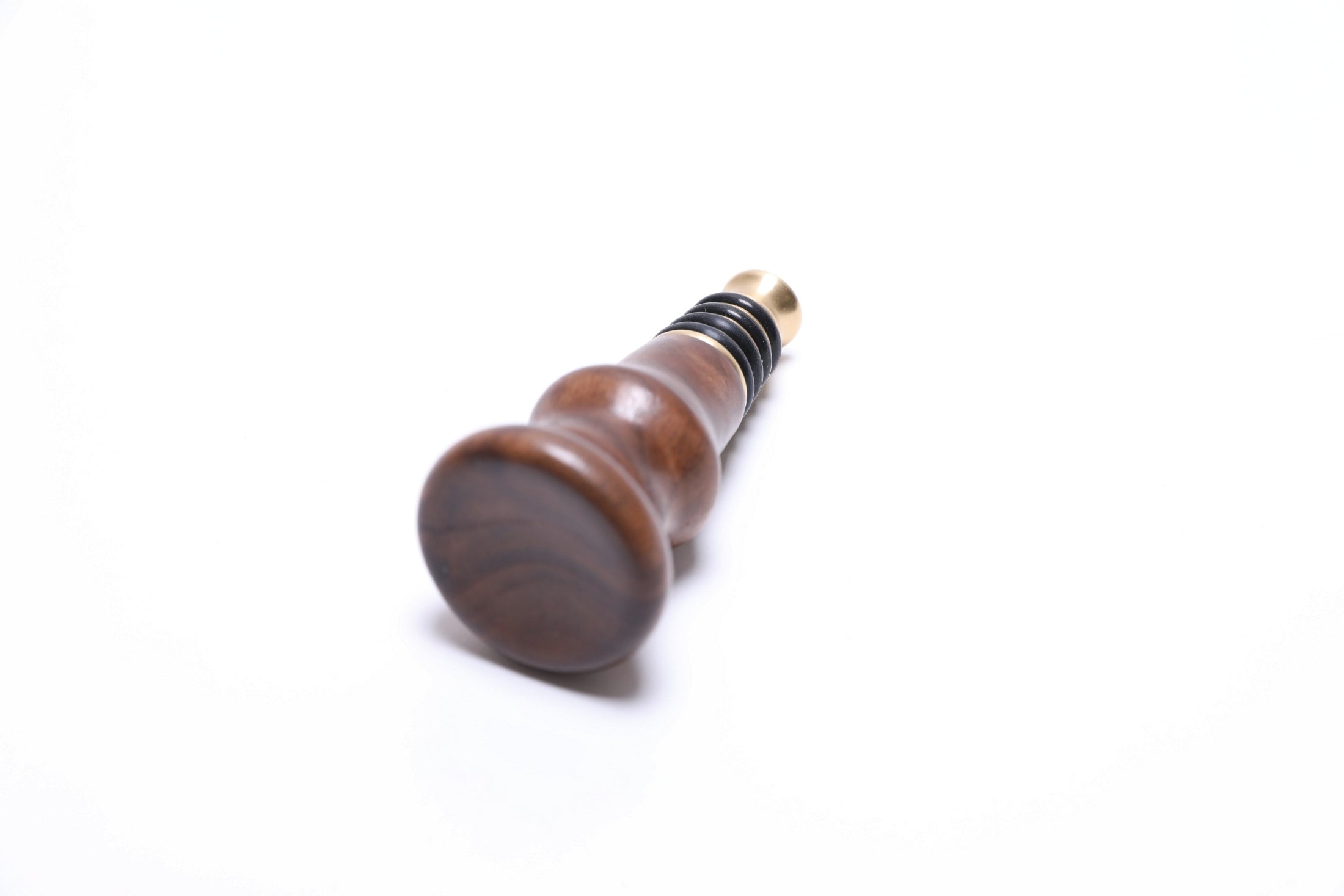 Wild black walnut burl wine stopper, top view showing crotch burl figure