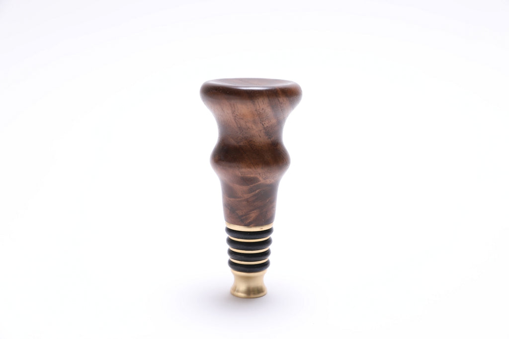 Walnut burl wine stopper standing upright, food-safe oil finish detail
