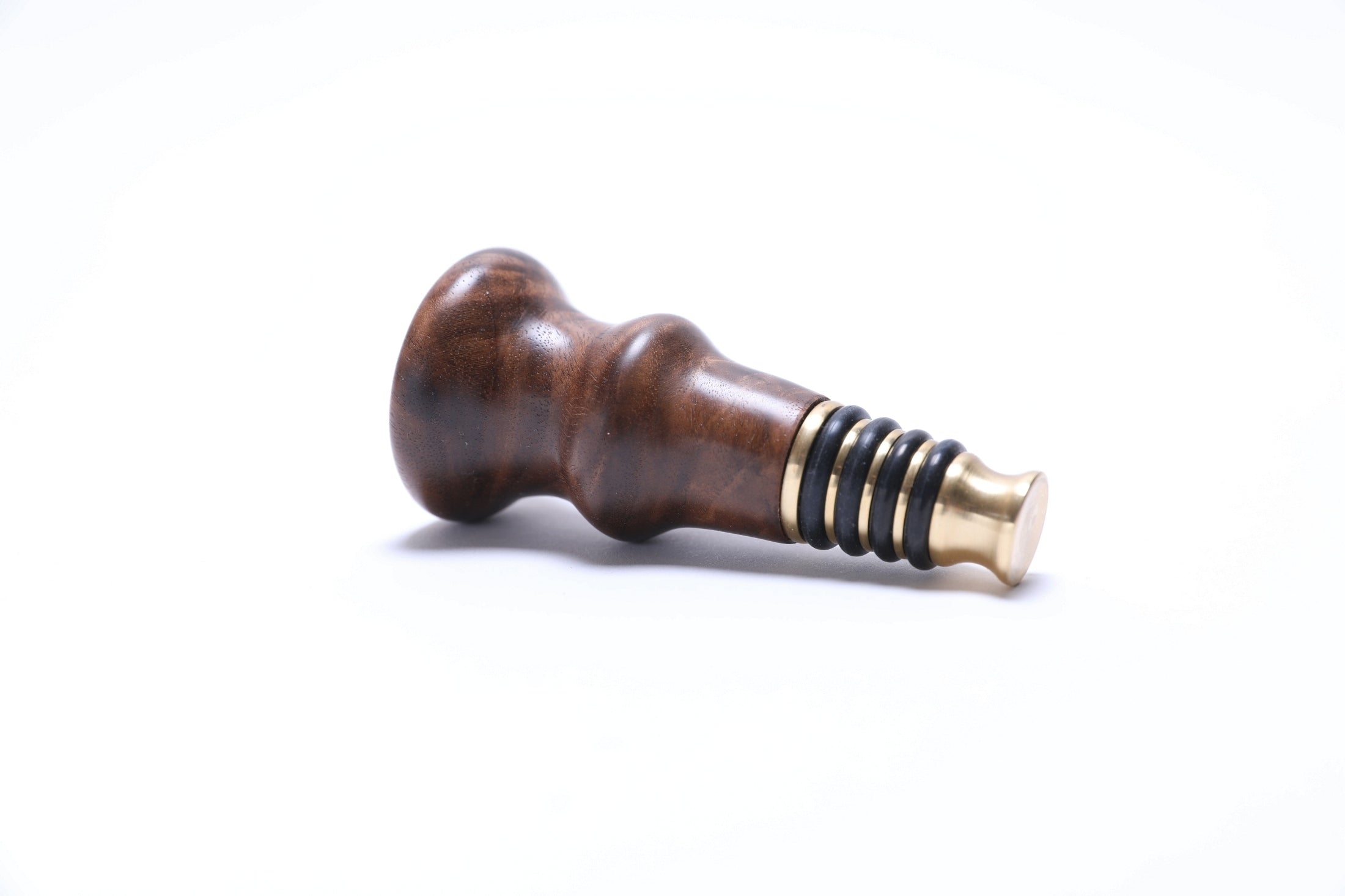 Handmade wooden wine stopper in black walnut burl, side profile