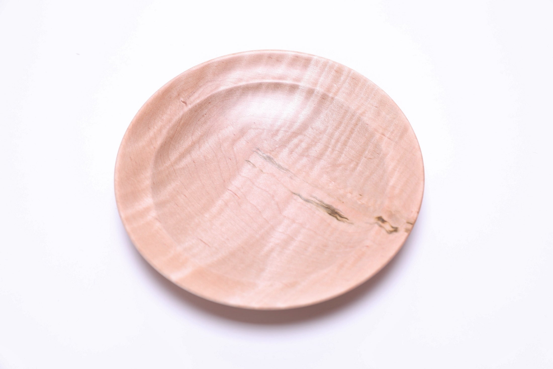 Handcrafted tiger maple ring dish, angled view highlighting wood grain