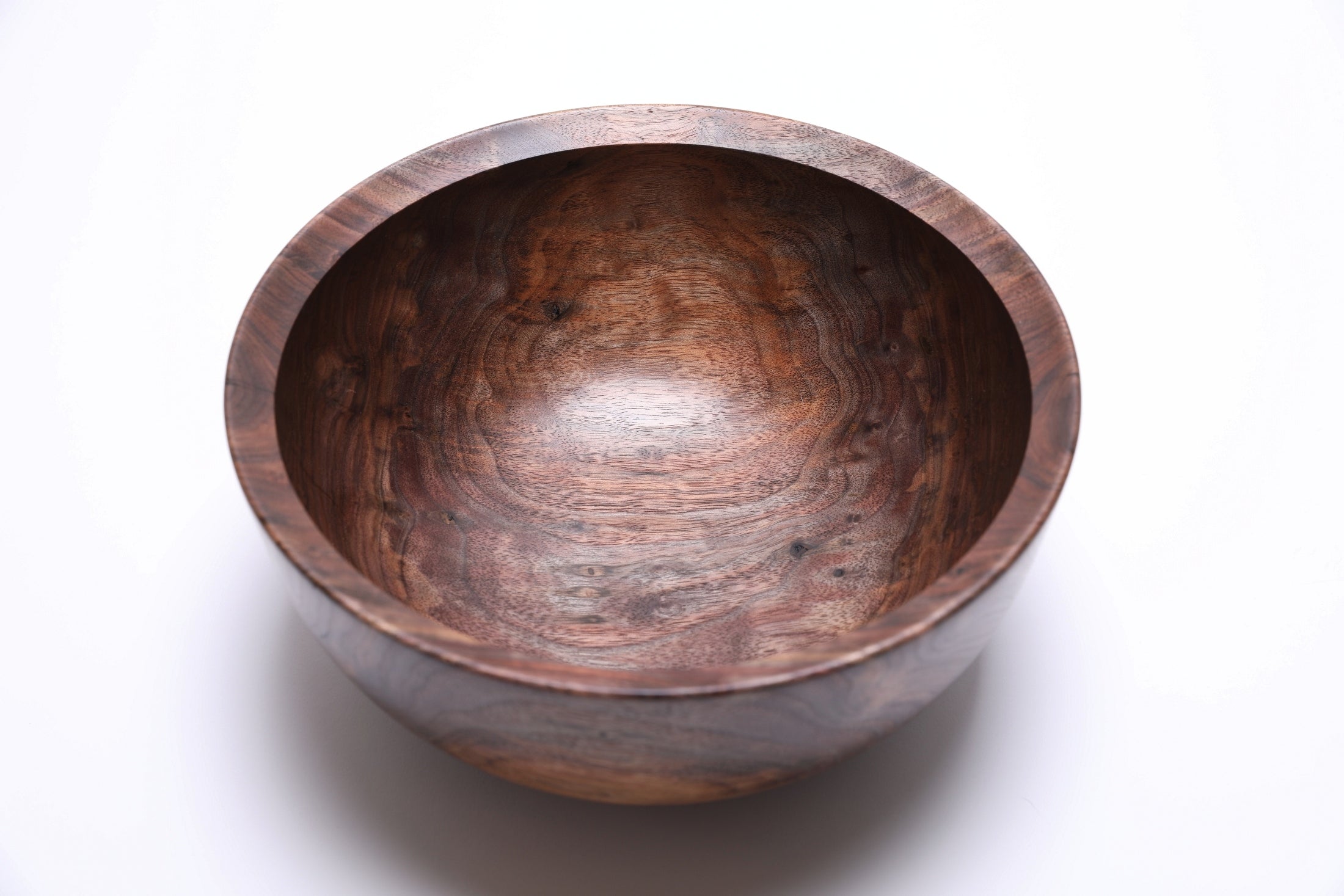 Medium sized handmade black walnut bowl, overhead view showing figure