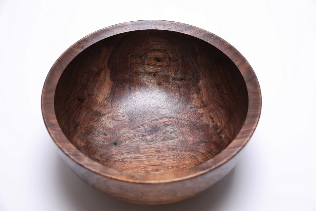 Wooden bowl on a white background