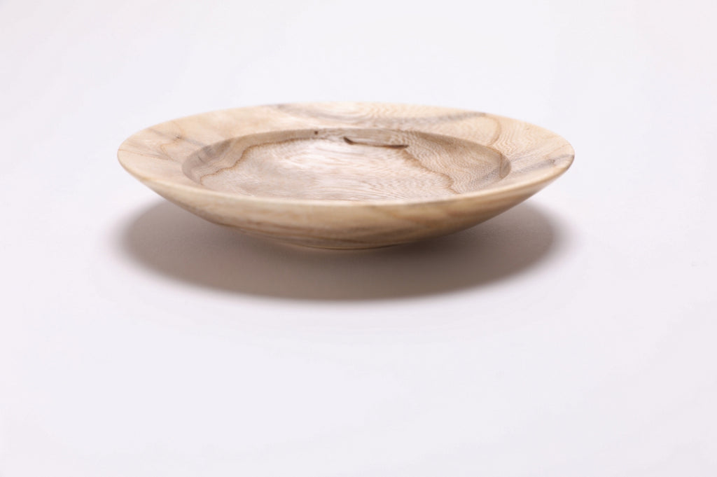 Ironwood ring dish with undercut rim and raised foot, side profile
