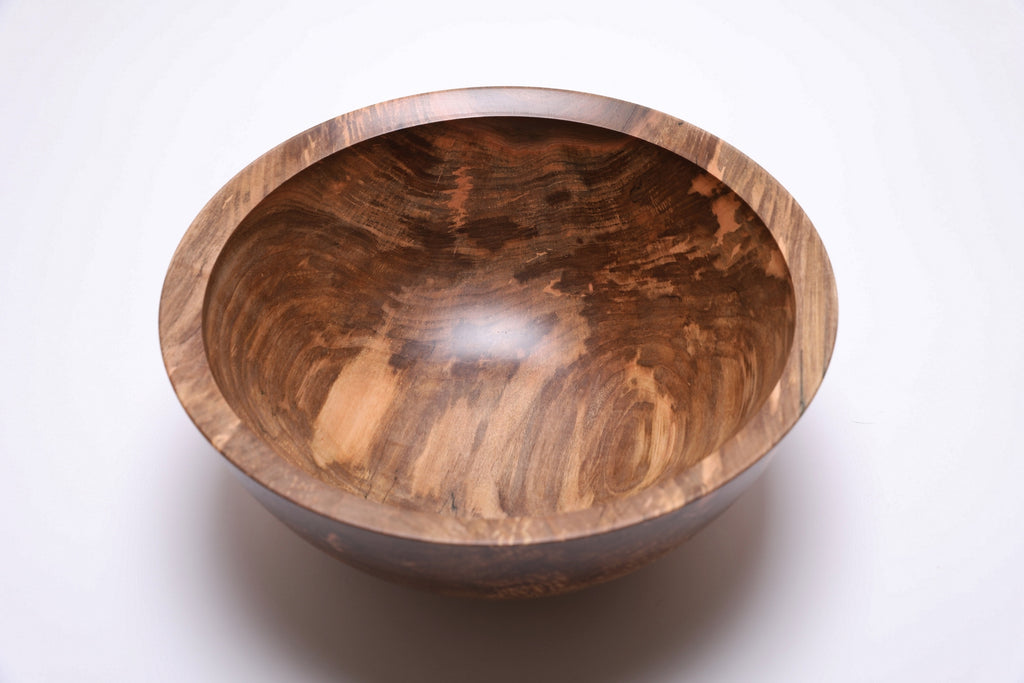 Top view of handmade spalted maple bowl with dramatic spalting transition lines from cream to ink black