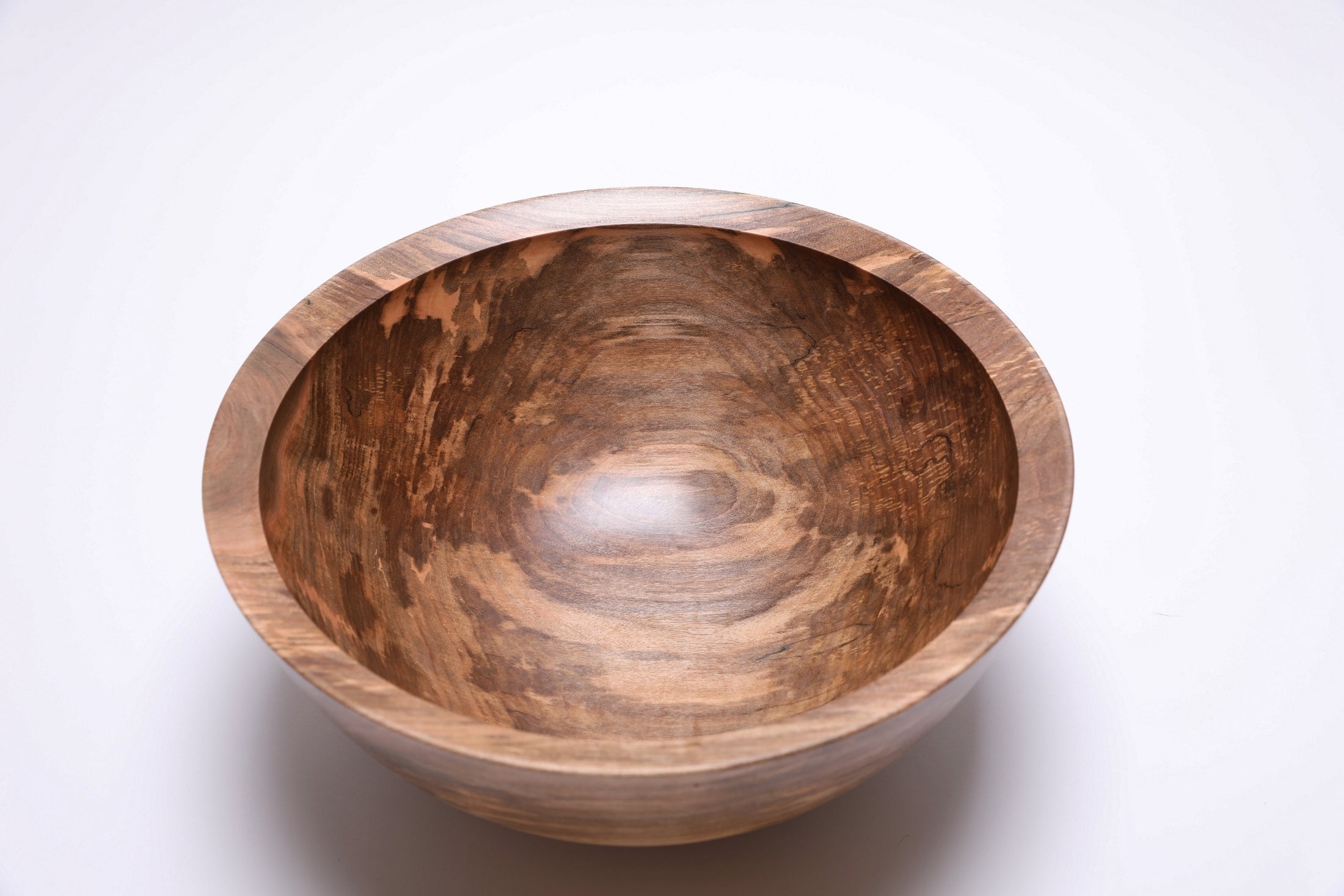 Close-up of spalted sugar maple grain showing ink-black transition lines and food-safe oil finish