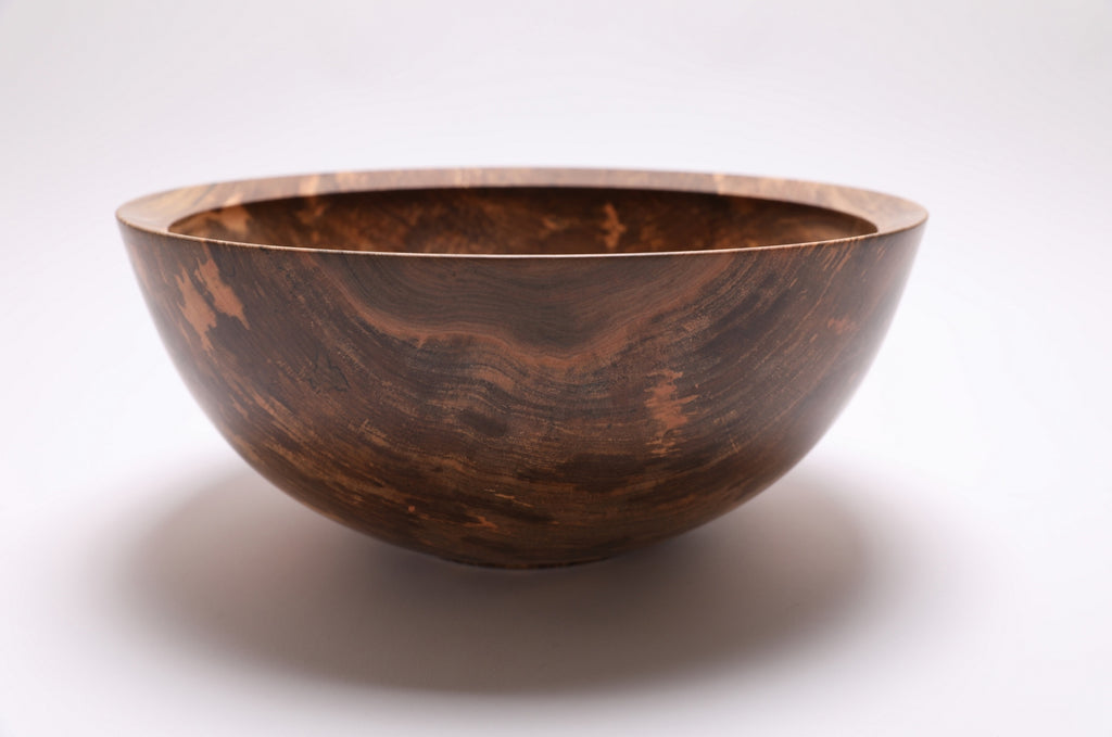Spalted sugar maple fruit and salad bowl, 13¼" wide, showing cream, salmon, amber, and ink-black grain patterns — Sanders Woodworking
