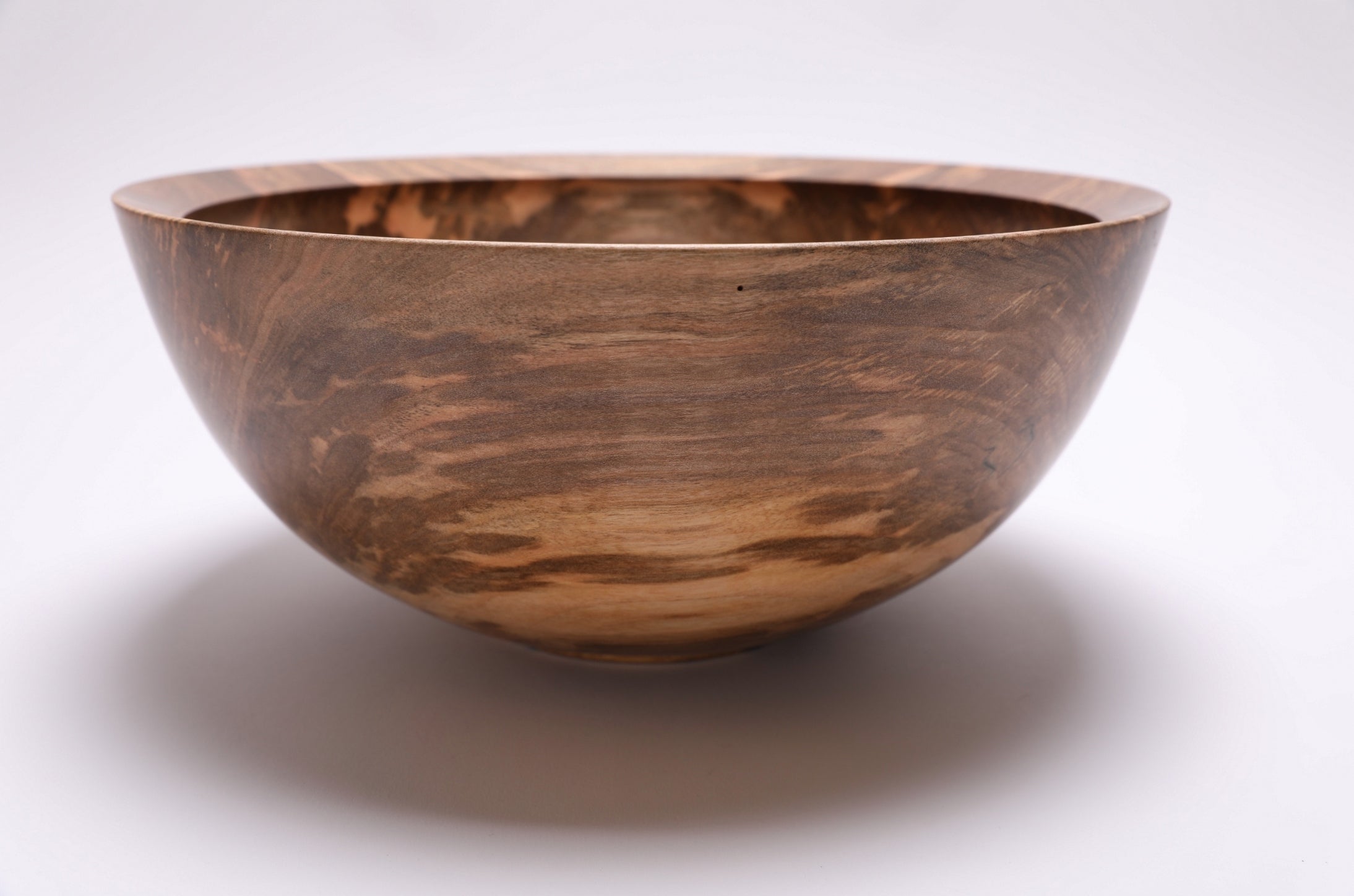 	Close-up of rounded-over undercut rim on spalted sugar maple bowl — handmade in North Carolina