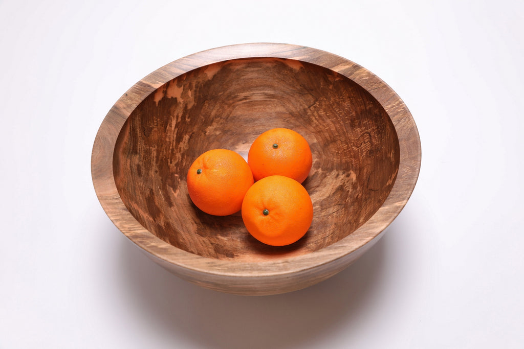 Spalted sugar maple fruit bowl with three oranges, gray and amber tones, handcrafted by Sanders Woodworking